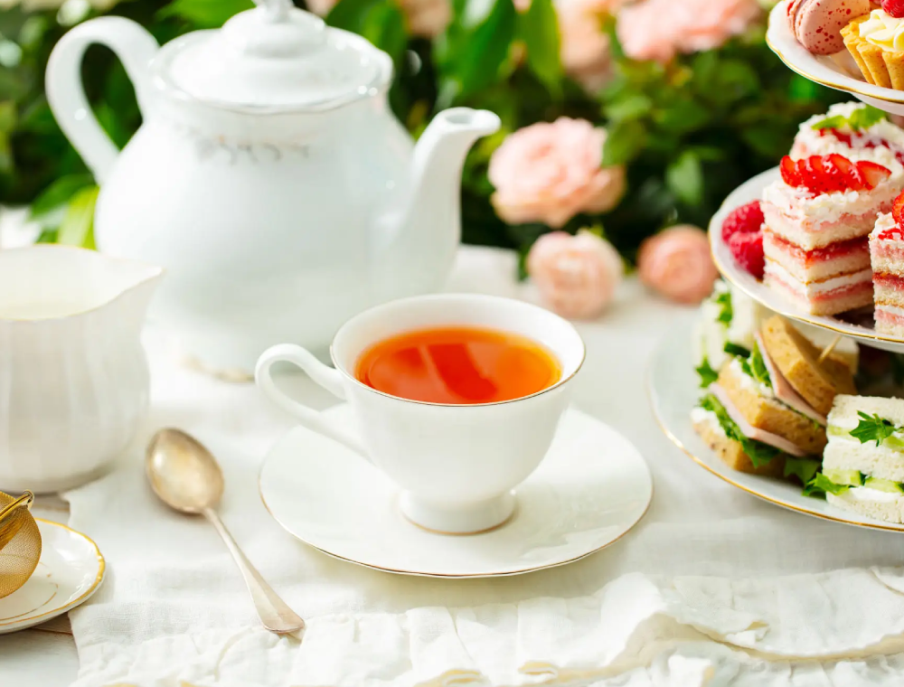 Afternoon tea setting with teacup and pastries
