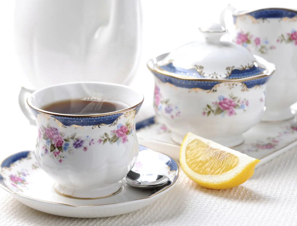 Tea in floral china cup with lemon wedge